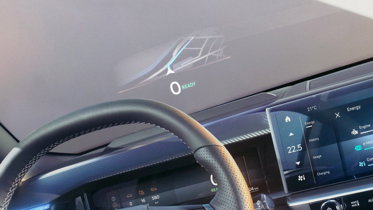 Close-up van het stuurwiel van een nieuwe Opel Grandland zwart interieur, met navigatie weergegeven op de voorruit