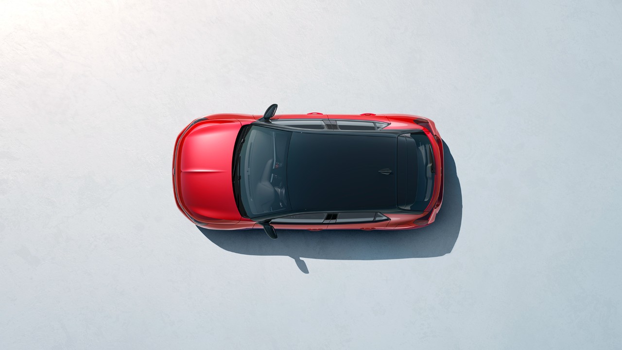 Bovenaanzicht van een Nieuwe Opel Corsa in rood met een zwart dak